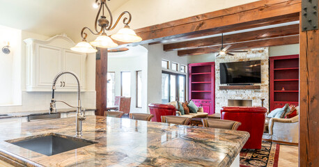 Elegant kitchen opens to a spacious living area with modern decor