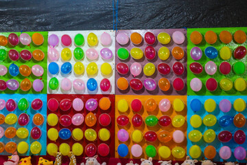 Balloon archery game to win prizes at amusement park. Colorful balloons on the wall to shoot