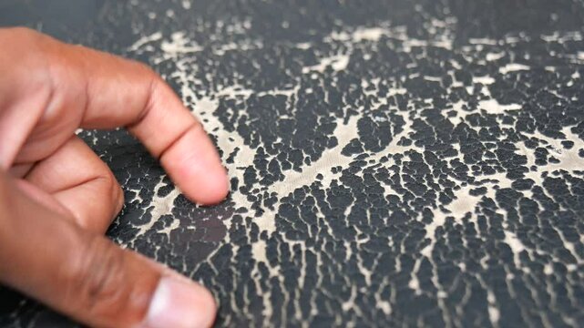 damage Leather with a cracked texture on a sofa .