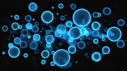 Bright Blue Bubbles Floating Against a Dark Background with Soft Light