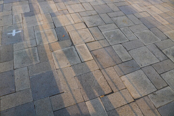 Gray tiled floor background detail. Cement floor in city park