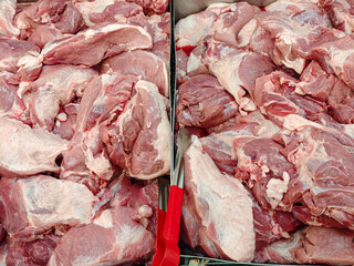 Fresh Cuts of Raw Meat Displayed at a Market Stall for Sale