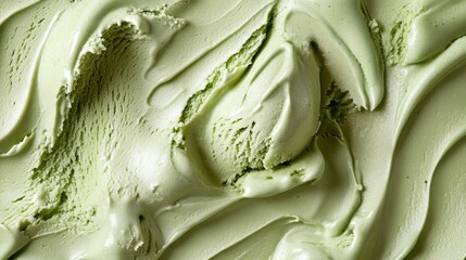 Obraz premium closeup of fresh matcha green tea ice cream texture, soft creamy surface, organic swirls pattern, artisanal gelato, fine granular detail, food photography, frosty cold dessert, mint sage color palette