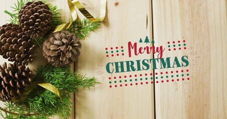 Image of merry christmas text over pine cones