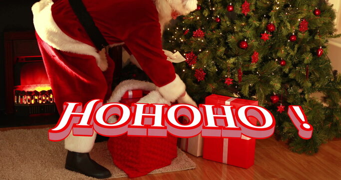 Image of hohoho text over santa claus with presents