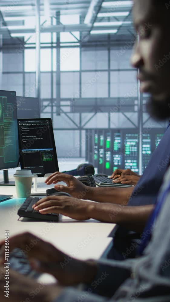 Poster vertical video programmer seeing red critical error popup on computer display in data center, panick