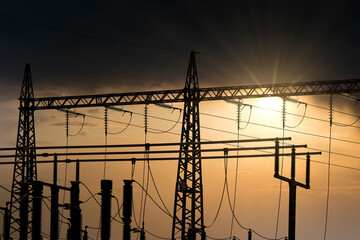 Transforming station with moody sunset sky background. 