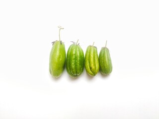 Averrhoa bilimbi, or Belimbing Wuluh or Belimbing Sayur is a type of star fruit on white. The fruit is native to Indonesia and the tropics. It tastes sour and is commonly used for seasoning dishes.
