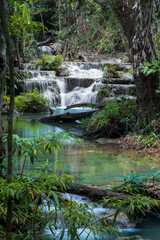 Scenic deep forest waterfalls at Erawan water falls national park, in Thailand