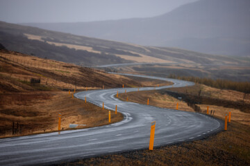 Scenic winding high way through the fields in rural Iceland