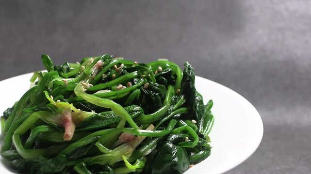 Spinach greens blanched in boiling water. Korean style vegetable side dish.
