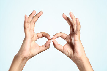 women making signs with her fingers
