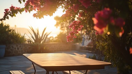 Naklejka premium A serene outdoor setting with a wooden table surrounded by blooming flowers at sunset.