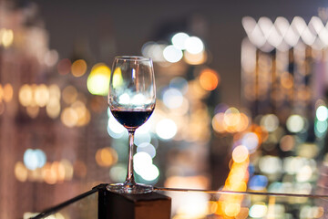 drink wine to celebrate new year. the background is a city.
