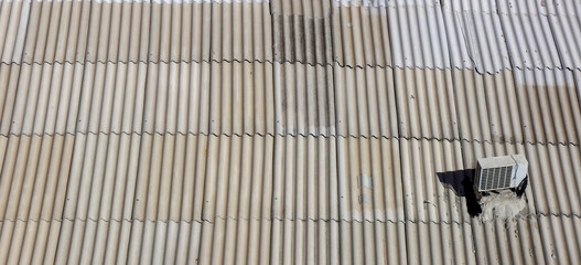Panoramic view of old building metal roof with air conditioner
