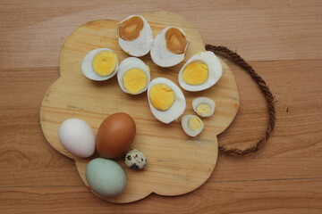 eggs in a bowl on wooden table