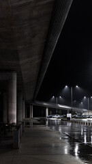 Overpasses and parking lots on rainy, dark days