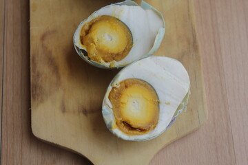 salt eggs on wooden table