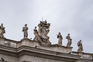 Statues on colonnades on St. Peter's Square in Vatican, Rome against