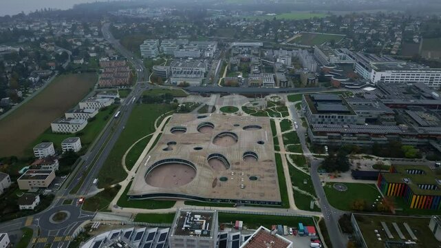 Dolly in drone shot over EPFL Rolex Learning Center in Lausanne Switzerland