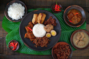 Gudeg is a traditional Javanese dish made from young jackfruit stewed in coconut milk and palm...