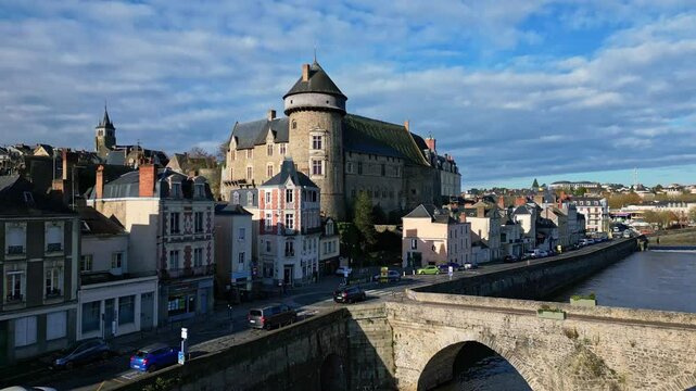 The famous Laval Castle and the old bridge on a beautiful daytime, Laval, Mayenne, France.