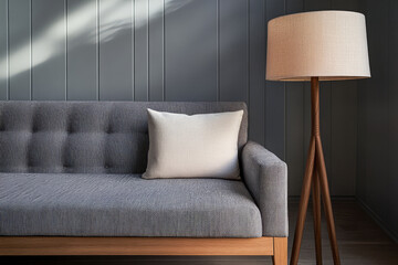 Cozy living room with grey sofa and modern floor lamp in a stylish interior