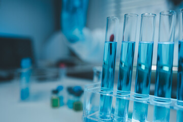 a chemist examines a sample of a liquid in a laboratory, a laboratory filled with scientific experiment equipment, microscope, female scientist, female chemist, researcher is searching for scientific