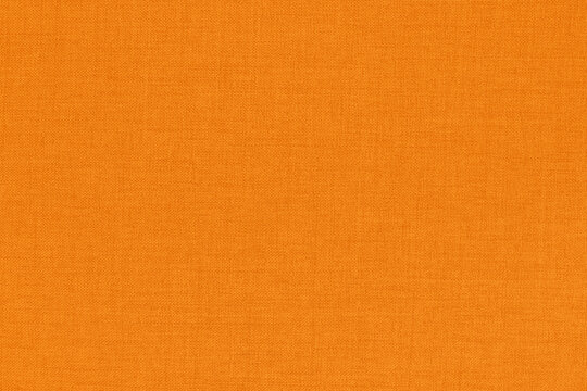 Orange fabric cloth texture for background, natural textile pattern.