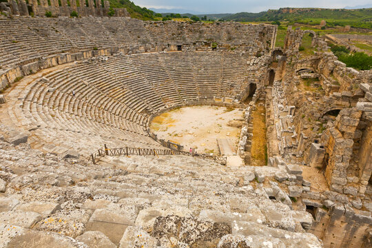 Scenic view of remains of antique Roman theater of ancient city of Perga in Antalya province on spring day. Archaeological and historical sights of modern Turkey