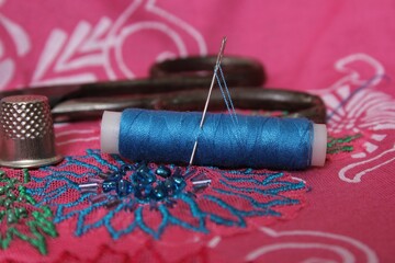 Sewing Essentials with Blue Thread and Needle