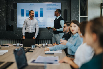 A diverse group of business people engaged in a corporate meeting, discussing strategies and ideas. The collaborative atmosphere highlights teamwork and communication in a modern office setting.