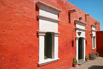 Stunning orange red exterior with white window historic buildings in the Convent of Santa Catalina de Siena, Arequipa, Peru, South America