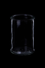 low transparent glass cup on black background