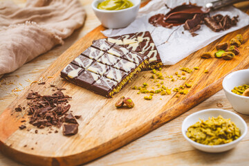 Homemade Dubai Chocolate bar with green kadayif and pistachio spread with baking ingredients