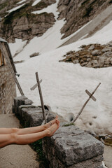 Fototapeta premium Serene Snowy Hiking Trail with Resting Feet in German Alps, Allgäu