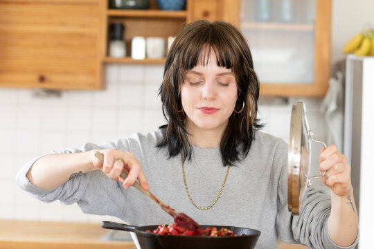 young woman cooking in the kitchen