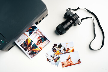 Printer and photo camera on table. Printing photos concept