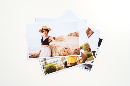 Printed colorful photos of women portraits against gray background