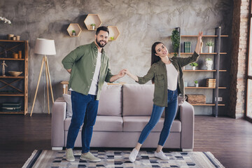 Photo of happy excited married lady guy wear khaki shirts having fun smiling indoors room home house
