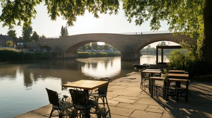 Beautiful bridge reflecting in calm water during golden hour in a quaint riverside town