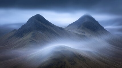 Misty Peaks Enveloped In Soft Morning Clouds
