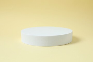 Props for product photography. White podium on a colored background