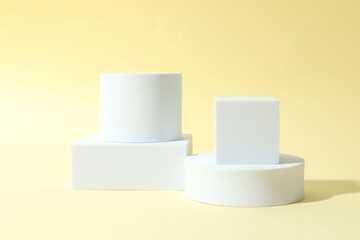 Props for product photography. Different podiums on a colored background