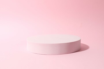 Props for product photography. Pink podium on a colored background