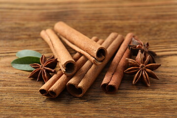 Aromatic cinnamon and anise stars on a wooden background