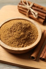 Aromatic cinnamon on a wooden background