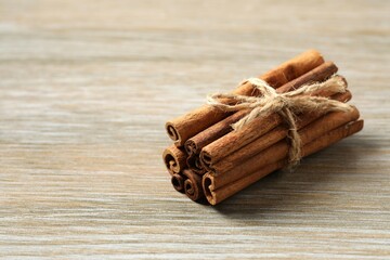 Aromatic cinnamon on a wooden background