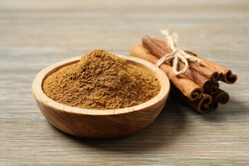 Aromatic cinnamon on a wooden background