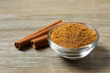 Aromatic cinnamon on a wooden background